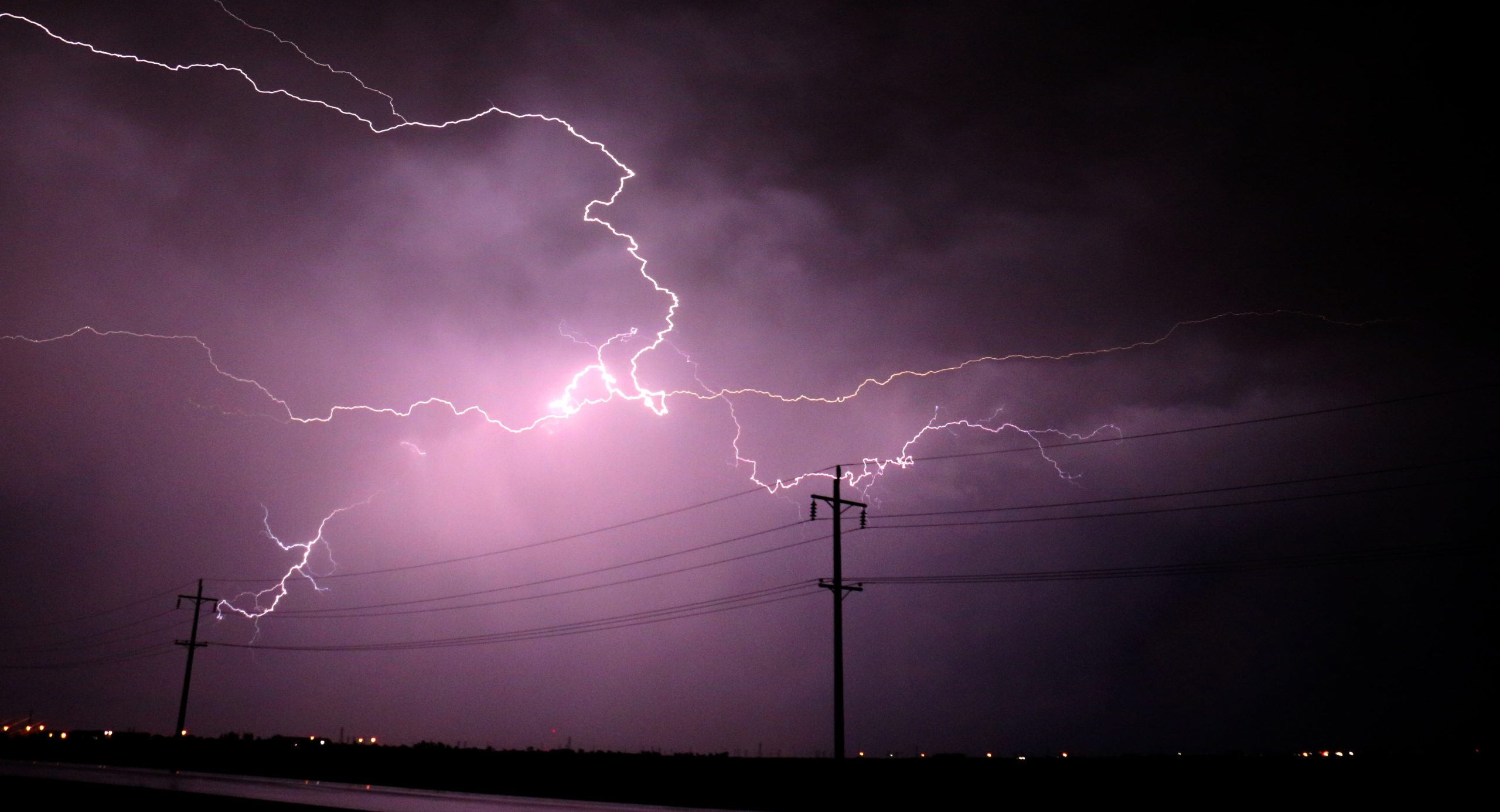 Lightning and Power Lines in a night storm