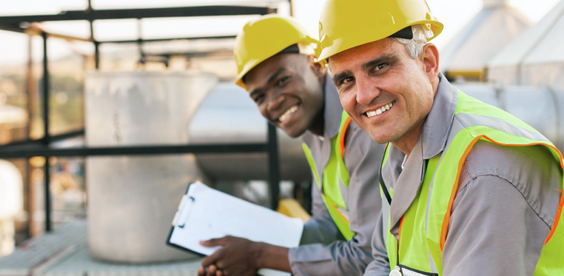 Two power plant workers with documentation